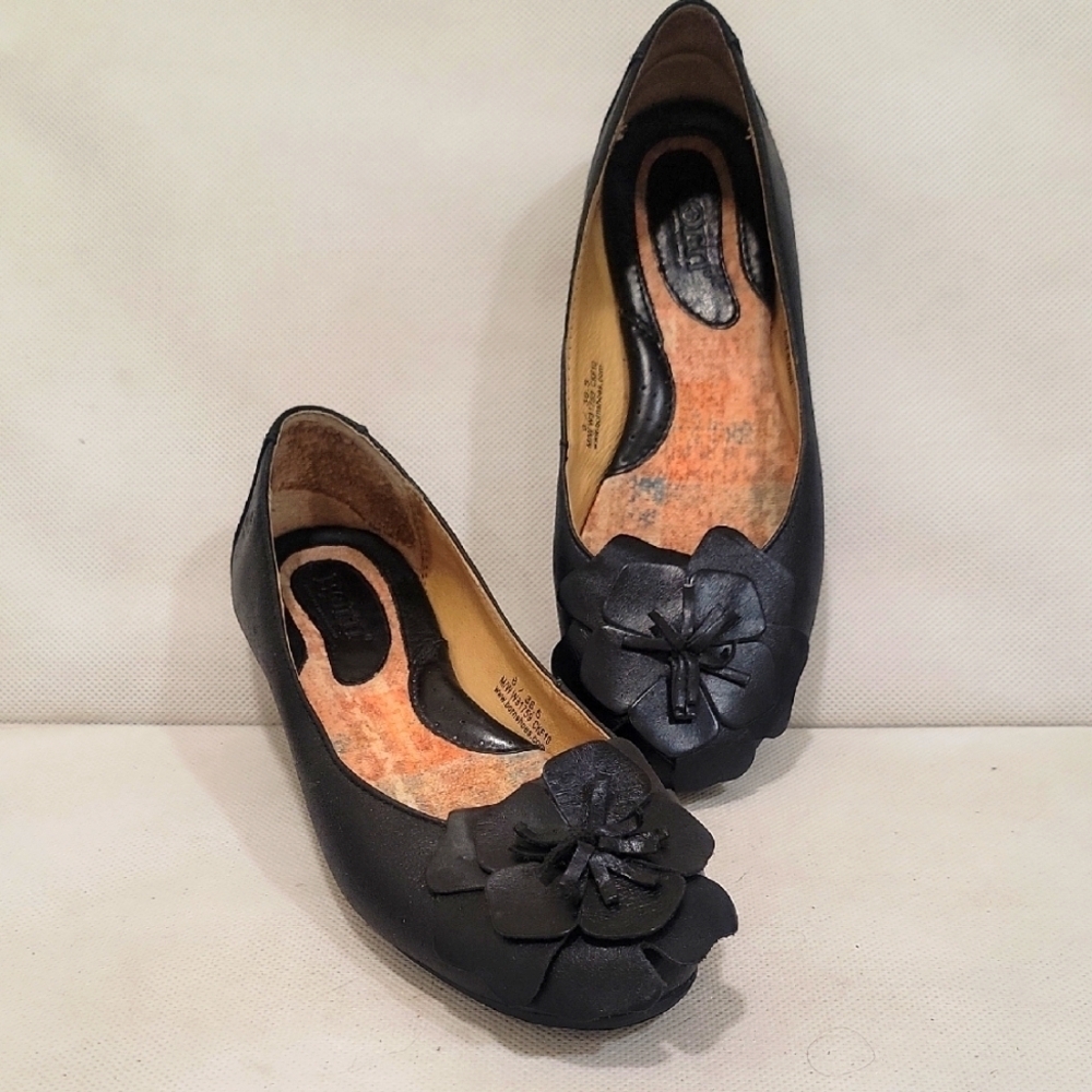 BORN BLACK LEATHER SLIP ON FLATS WITH A FLORAL DESIGN ON THE TOE
